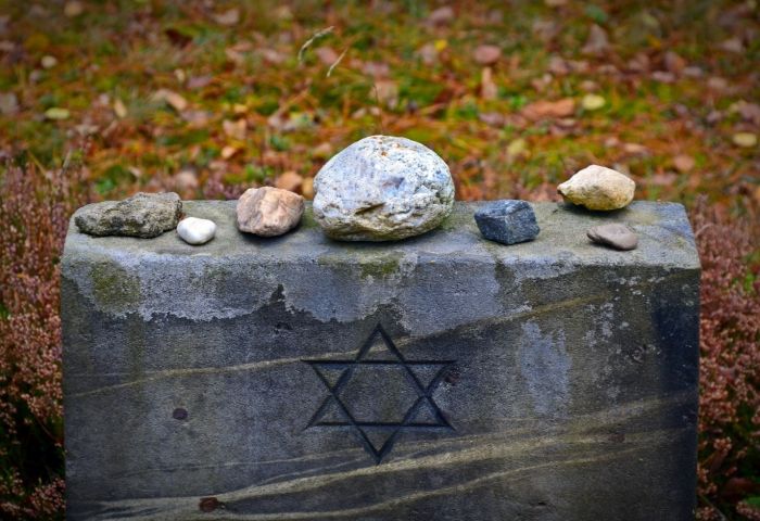 Holocaust victims buried after remains given to museum